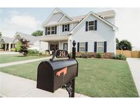 Charming two-story home with a well-manicured lawn, classic mailbox and stone accents at 258 Creek View Ln, Acworth, GA 30102