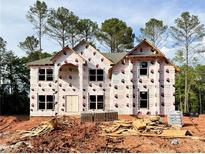 Exterior shot of a new two-story home under construction showing the shape and layout at 3018 Old Covington Rd, Covington, GA 30014