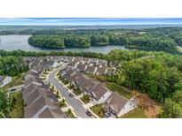 Beautiful aerial view of a neighborhood near a lake surrounded by lush green trees at 178 Sunshower Rdg, Canton, GA 30114