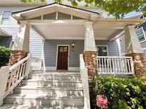 Charming front porch with stone accents and freshly painted steps, inviting entry to this home at 625 Chestnut St # D, Atlanta, GA 30354