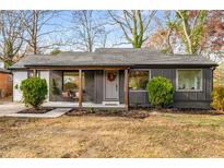 Charming single-story home featuring a cozy porch and stylish modern paint scheme at 1377 Dorothy Dr, Decatur, GA 30030