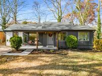 Charming renovated single-story home with well-maintained lawn and inviting front porch at 1377 Dorothy Dr, Decatur, GA 30030
