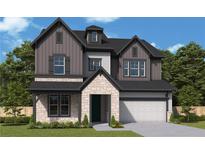 Charming two-story home featuring stone accents, gray siding, black trim, and a well-manicured lawn at 4740 Briscoe Drive, Cumming, GA 30028