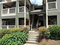 Inviting multi-level exterior showcasing well-maintained stairs and lush landscaping at 672 Mcgill Ne Pl # 672, Atlanta, GA 30312