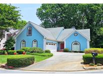 Charming two-story home with a well-maintained lawn and manicured shrubbery at 3740 Ashford Ne Pt, Brookhaven, GA 30319