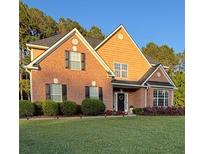 Charming brick and siding home with well-maintained landscaping and inviting curb appeal at 3 Tiffany Trce, Palmetto, GA 30268