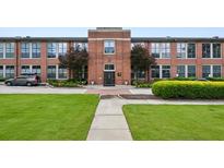 Charming brick exterior with manicured landscaping, sidewalk, and entrance at 1261 Caroline Se St # 108, Atlanta, GA 30307
