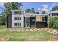 Modern home showcasing a distinctive architectural style with black brick and large windows at 1410 Lavista Ne Rd, Atlanta, GA 30324