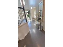 Bright foyer with high ceilings, staircase, console table and clerestory windows at 1932 River Crest Way, Lawrenceville, GA 30045