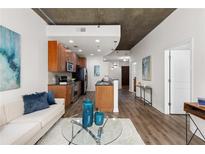 Modern open floorplan with hardwood floors, modern cabinets and stainless steel appliances at 855 Peachtree Ne St # 1508, Atlanta, GA 30308