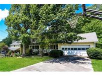 Charming two-story home with a well-manicured lawn and a basketball hoop at 3391 Quail Hollow Trl, Snellville, GA 30039
