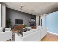 Contemporary living room features sleek furniture, modern decor, and concrete ceilings at 3300 Windy Ridge Se Pkwy # 1107, Atlanta, GA 30339