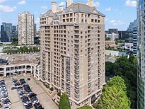 Luxury high-rise condo building with multiple balconies and a beige exterior at 3334 Peachtree Ne Rd # 1609, Atlanta, GA 30326