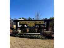 Chestnut Grove: A Starlight Homes community entrance sign with brick base and manicured landscape against a blue sky at 5002 Elowen Ln, Douglasville, GA 30135