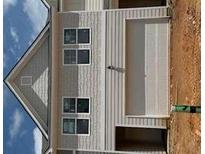 Exterior shot of a two-story house with gray siding and a two-car garage at 1023 Merritt Dr # 100, Villa Rica, GA 30180