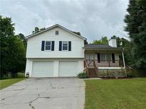 Charming two-story home with a two-car garage and welcoming front porch at 23 Jennifer Ln, Rydal, GA 30171