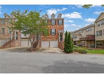 Charming brick townhome with dormer windows and attached garages in a well-kept neighborhood at 2207 Concordia Se Way # 12, Mableton, GA 30126
