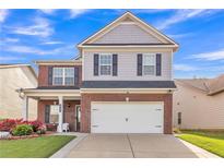 Charming two-story home with brick and siding, well-maintained lawn, and attached two-car garage at 911 Sonoma Dr, Lawrenceville, GA 30045