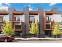 Modern townhome featuring sleek architectural design, balconies, and well-maintained landscaping at 367 Parkway Ne Dr # 3, Atlanta, GA 30312