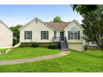 Charming home with well-maintained lawn, inviting front porch, and classic curb appeal at 7434 Chads Cir, Jonesboro, GA 30236