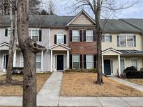 Charming townhouses featuring varied facades and well-maintained landscaping at 20 Pine Canyon Sw Dr # 41, Atlanta, GA 30331