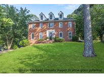 Charming brick home with a beautifully maintained lawn, perfect for families at 361 Sarah Ln, Lawrenceville, GA 30046