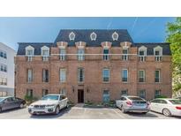 Classic brick building with multi-pane windows and architectural roof details at 3649 Peachtree Ne Rd # 305, Atlanta, GA 30319
