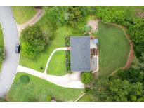 An aerial view of a well-maintained property featuring a lush lawn and mature trees at 388 Talcott Nw Cir, Marietta, GA 30064