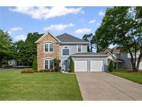Charming two-story home featuring a stone facade and a two-car attached garage at 2261 Seatton Ct, Marietta, GA 30062