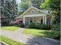 Charming single-story home with well-maintained landscaping and a welcoming front porch at 1231 Mansfield Ne Ave, Atlanta, GA 30307