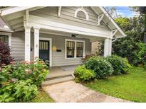 Charming front porch with swing and well-maintained landscaping leading to the entrance at 1231 Mansfield Ne Ave, Atlanta, GA 30307