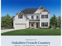 Charming two-story home with a brick and siding exterior, attached garage, and well-manicured lawn at 2002 Freestone Way, Marietta, GA 30064