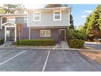 Charming townhome with well-maintained landscaping and designated parking spaces in a desirable community at 3147 Buford Ne Hwy # 8, Brookhaven, GA 30329
