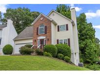 Charming two-story home featuring a well-manicured lawn and inviting front entrance at 4305 Chesapeake Trce, Acworth, GA 30101
