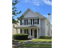 Charming two-story home with a covered front porch and well-maintained landscaping at 4677 Liberty Square Dr, Acworth, GA 30101