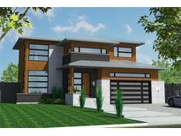 Modern two-story home with wood and white brick exterior and a sleek, contemporary design at 21 Elm St, Hampton, GA 30228