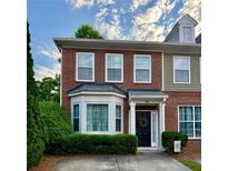 Charming brick townhouse with a well-maintained front yard and inviting entrance at 2167 Del Lago Cir # 11, Kennesaw, GA 30152