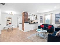 Bright and inviting living space with a kitchen, dining area, and living room at 251 Aurora Nw Ave, Atlanta, GA 30314
