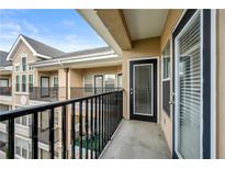 View from balcony with black railings and multi-story condo building at 1850 Cotillion Dr # 4419, Atlanta, GA 30338