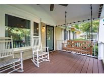 Inviting front porch with rocking chairs and a porch swing, perfect for relaxing outdoors at 118 Lucia Dr, Smyrna, GA 30082