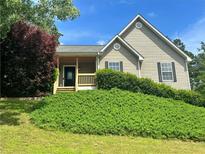 Charming home with a covered porch and well-maintained landscaping at 107 Oconnor Dr, Dallas, GA 30157