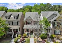 Charming two-story home with manicured front yard and inviting curb appeal in a desirable neighborhood at 1744 Habershal Nw Rd, Atlanta, GA 30318