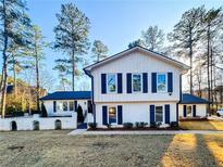 Charming two-story home with black shutters and a well-manicured front yard at 110 Randomwood Way, Alpharetta, GA 30022