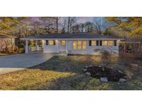 Charming single-story home with a manicured front yard and covered carport at 2480 Miriam Ln, Decatur, GA 30032