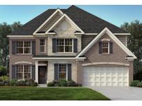 Charming two-story home featuring a mix of brick and stone, complemented by dark shutters and a well-manicured lawn at 3910 Near Star Ln, Cumming, GA 30028
