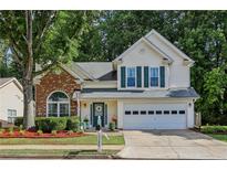 Charming two-story home with a well-manicured lawn and a two-car garage in a great neighborhood at 3388 Washington Cmns Nw Ave, Kennesaw, GA 30144