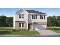 Charming two-story home featuring a mix of brick and white siding, a two-car garage, and a well-maintained lawn at 237 Paisley Way, Locust Grove, GA 30248