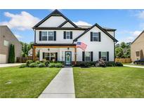 Charming two-story home featuring a well-manicured lawn and inviting front porch at 247 Creek View Ln, Acworth, GA 30102
