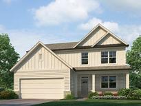 Charming two-story home featuring a classic design, attached two car garage, and a beautifully landscaped front yard at 80 Hampton Ter, Dallas, GA 30157