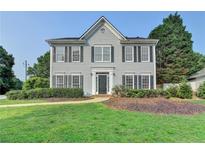 Charming two-story home with symmetrical windows and a well-maintained lawn at 4901 Briarleigh Chase Sw, Mableton, GA 30126